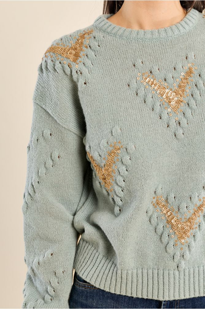 Pale turquoise sweater with sequence